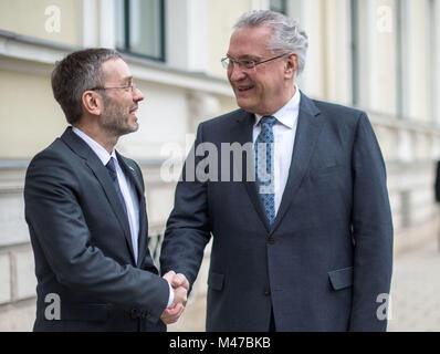Munich, Germany. 15th Feb, 2018. Joachim Herrmann (CSU, R), Minister of Interior of the state of Bavaria, shaking hands with Herbert Kickl (FPO), Austrian Minister of Interior, during the latter's inaugural visit to Munich, Germany, 15 February 2018. Credit: Lino Mirgeler/dpa/Alamy Live News Stock Photo