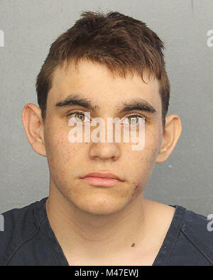 Parkland, USA. 14th Feb, 2018. Nikolas Jacob Cruz, age 19, is seen on February 14, 2018 in this booking photograph provided by the Broward County, Florida Sheriff's Office. Cruz was arrested and charged with 17 counts of premeditated murder after opening fire at Marjory Stoneman Douglas High School in Parkland, Florida, killing 17 people and injuring 14 others. Cruz was a former student at the school who had been expelled last year. He is believed to have been armed with an AR-15-style semi-automatic rifle. Credit: Paul Hennessy/Alamy Live News Stock Photo