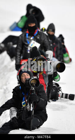 Pyeongchang, Korea. 15th Feb, 2018. Photographers are seen during the biathlon endurance race, 20 KM, men, within the 2018 Winter Olympics in Pyeongchang, South Korea, February 15, 2018. Credit: Michal Kamaryt/CTK Photo/Alamy Live News