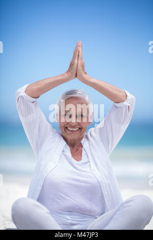 Beautiful mature woman posing with hands joined