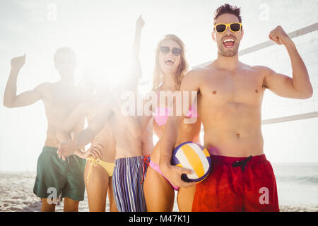 Successful friends in line after playing volleyball Stock Photo