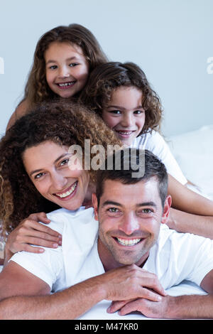 Portrait of a family lying on top of each other Stock Photo