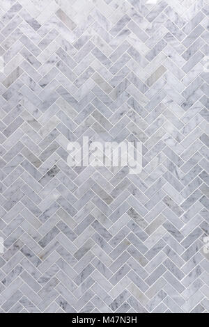 Background of grey and white marble tile in herringbone pattern Stock Photo