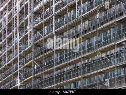 huge building facade with scaffolding,  construction site Stock Photo