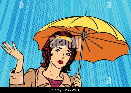 Beautiful sad girl in rain with umbrella, bad weather Stock Photo