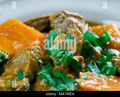 German traditional beef stew with carrots, dark beer Stock Photo