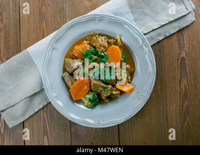 German traditional beef stew with carrots, dark beer Stock Photo