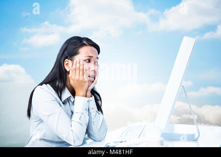 Composite image of exhausted businesswoman with hands on face Stock Photo