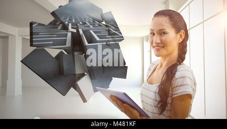 Composite image of businesswoman using tablet in the office Stock Photo