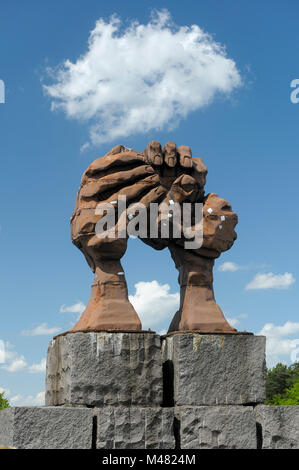 Memorial sculpture Die Wolbung der Hande (The Curvature of the Hands) from 1995 by Jose Castell on West German side of the former DDR (Grenzubergangss Stock Photo