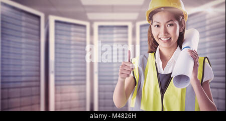 Composite image of architect woman with thumbs up Stock Photo