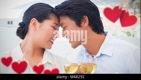 Composite image of hearts hanging on a line Stock Photo