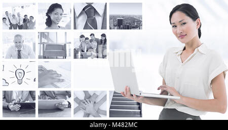 Composite image of asian businesswoman using laptop Stock Photo