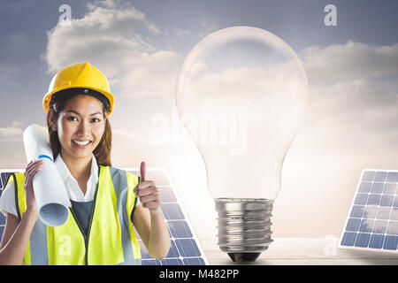 Composite image of architect woman with thumbs up Stock Photo