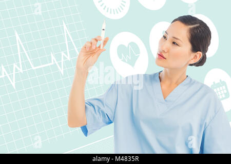 Composite image of serious doctor holding an injection in hospital Stock Photo