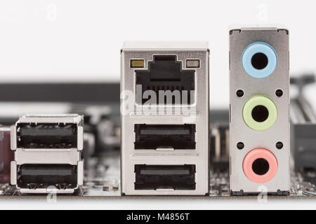 usb 2.0 ports, lan RJ-45 port, light blue line in port, lime line out port and pink microphone port Stock Photo