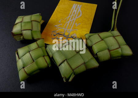 Rice dumpling and money packet decoration for Eid Mubarak celebration. Stock Photo