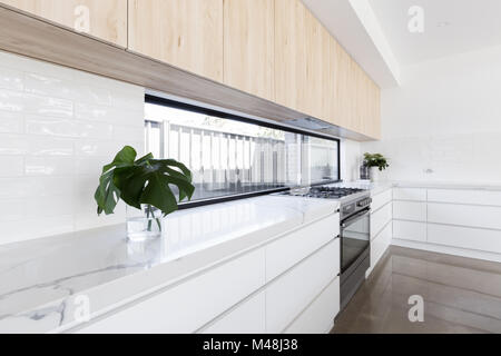 Modern luxury kitchen with window splashback Stock Photo