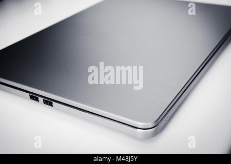 Stylish modern metallic laptop on a white background Stock Photo