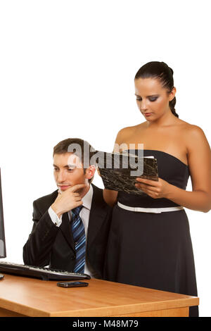 businesspeople discussing while working at the computer Stock Photo