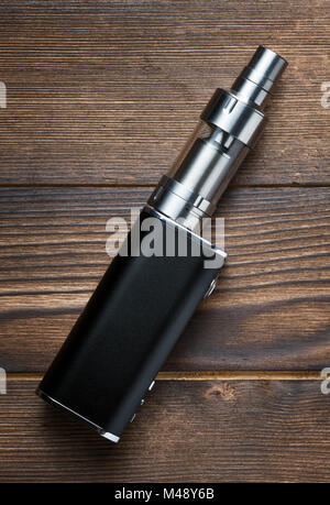 electronic cigarette on brown wooden background Stock Photo