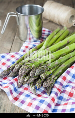 Bunch of fresh green asparagus spears on the table Stock Photo