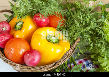 Fresh vegetables covered with water drops in basket Stock Photo