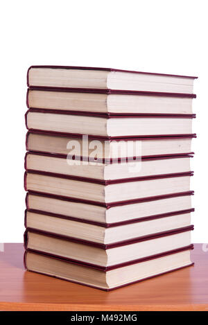 Stack of books arranged the office desk Stock Photo