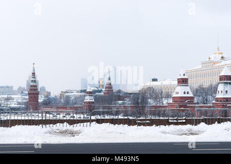 Moscow Kremlin towers, skyscrapers of the International Business Center in the background. Cold and snowy winter day Stock Photo