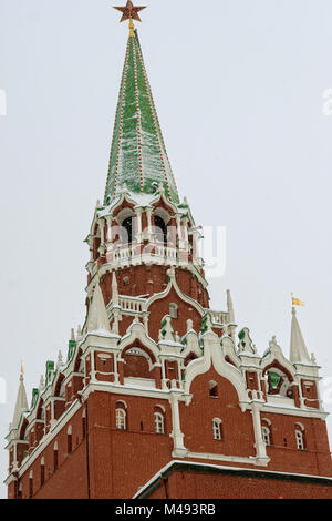 Troitskaya, Trinity, tower of Moscow Kremlin, topped with a red star in winter. This tower gates serve as the main tourist entrance to the Kremlin Stock Photo