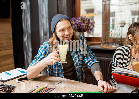 Man portrait with tea in the cafe Stock Photo