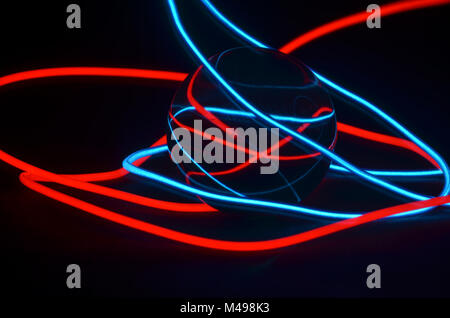 Glass ball and light strip Stock Photo