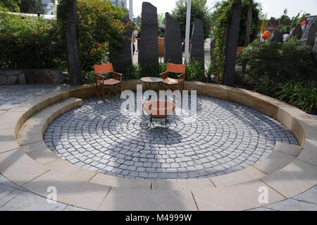Garden with terrace, granite-pavement and fire-place Stock Photo