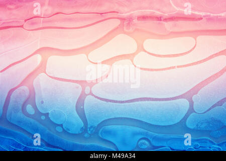 Natural background. Frozen water. Abstract pattern formed on a frozen puddle. Gradient color Stock Photo