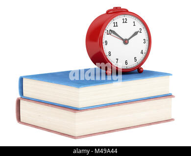 red alarm clock with two books isolated on white background Stock Photo