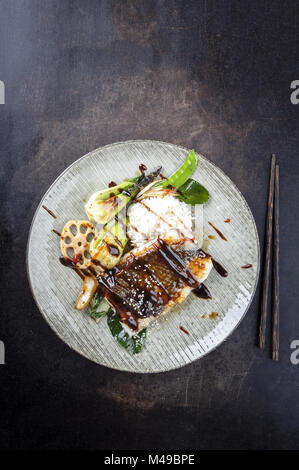 Japanese Coalfish with Vegetable and Rice on Plate Stock Photo