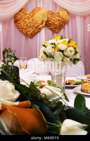 Wedding bouquets on table at reception dinner party Stock Photo