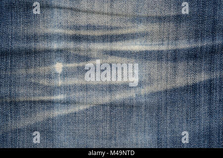 Texture of blue denim fabric. denim jeans material texture creased dirty background pattern concept Stock Photo