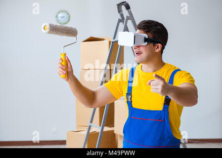 Painter contractor working with virtual reality goggles Stock Photo