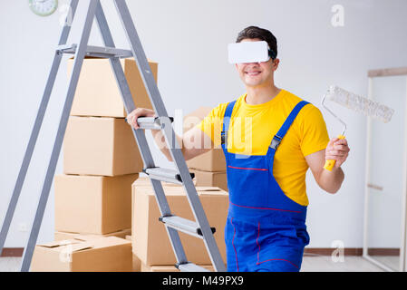Painter contractor working with virtual reality goggles Stock Photo