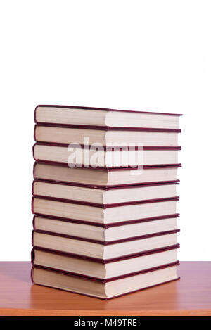 Stack of books arranged the office desk Stock Photo