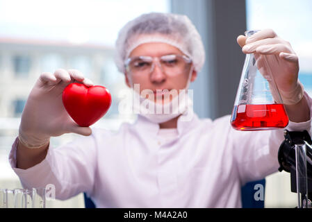 Doctor curing heart in medical concept Stock Photo - Alamy