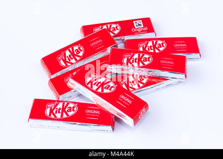 A pile of two finger Kit Kat chocolate biscuits from a multipack sold in the United Kingdom, on a white background Stock Photo
