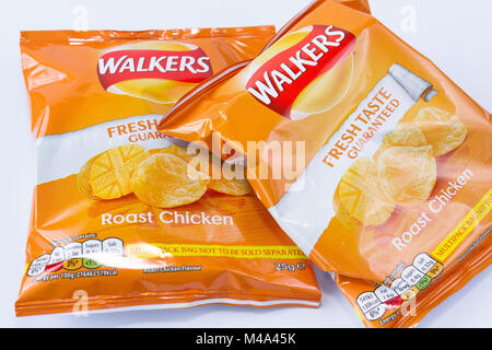 Two packets of Walkers roast chicken flavour crisps from a multipack, United Kingdom Stock Photo