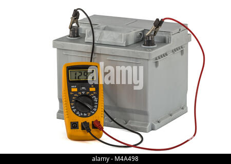 Checking voltage of automotive battery, isolated on white background Stock Photo
