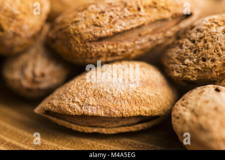 Heap of almond nuts in shell Stock Photo