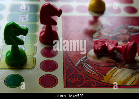 French ludo game (Petits Chevaux) with horse-shaped tokens Stock Photo