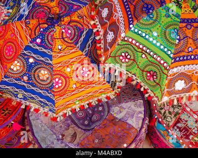 Close up of display of bright traditional embroidered fabrics from India in different colours Stock Photo