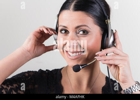 Cheerful customer service agent, telemarketing lady Stock Photo