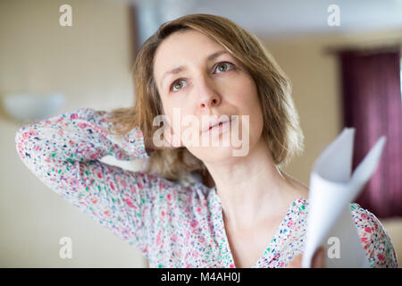 Mature Woman Experiencing Hot Flush From Menopause Stock Photo